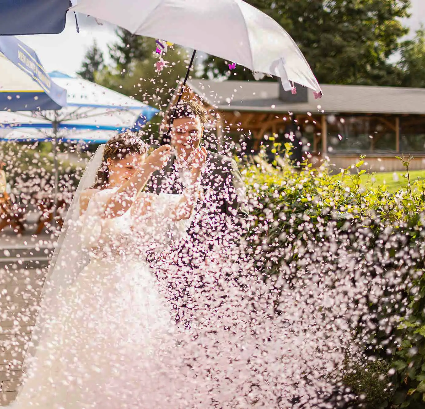 Bride and groom in a shower of confetti
